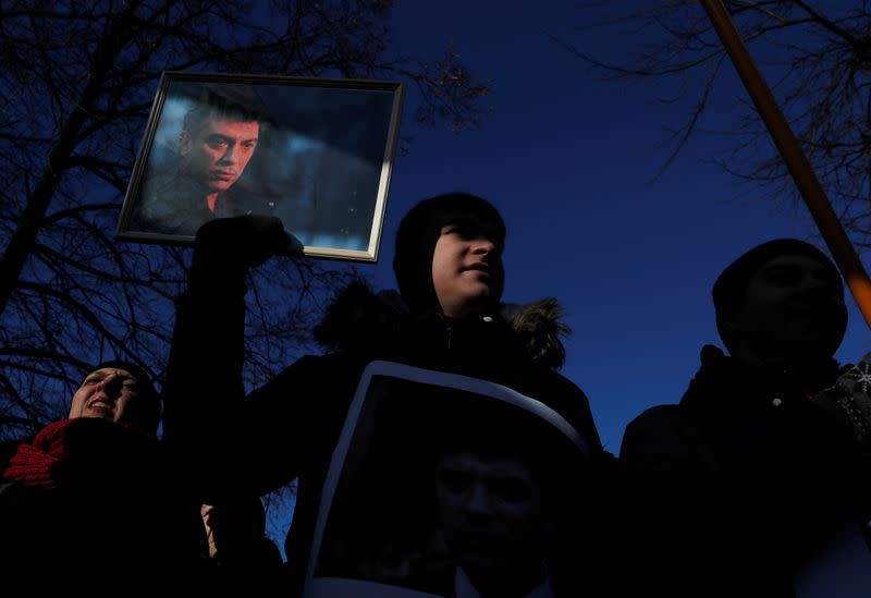 People take part in a rally marking the 5th anniversary of Russian opposition politician Boris Nemtsov's murder, in Saint Petersburg