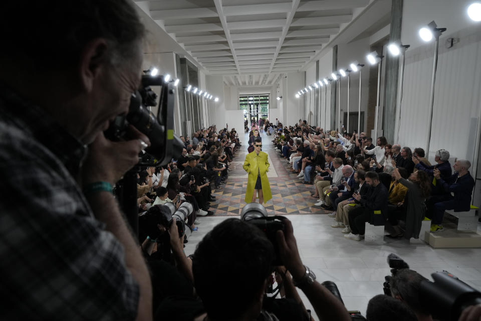 Models wear creations as part of the Gucci men's Spring Summer 2025 collection, that was presented in Milan, Italy, Monday, June 17, 2024. (AP Photo/Luca Bruno)