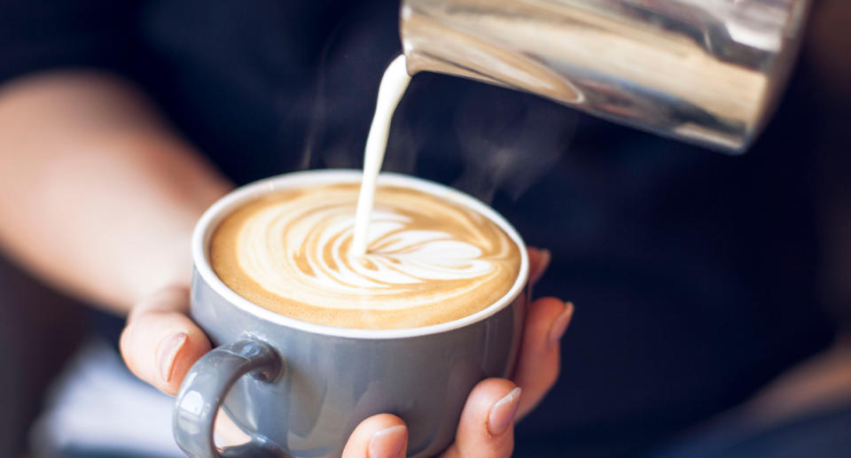 Pictured is a coffee poured by a barista. Source: Getty Images