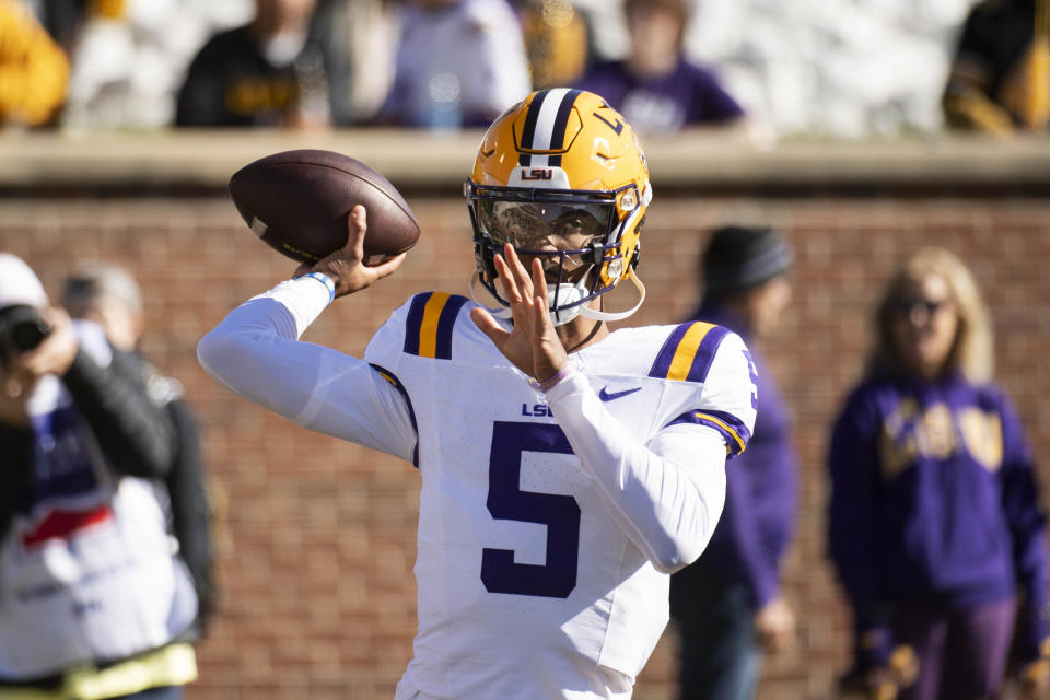 LSU quarterback Jayden Daniels warms up before the start of an NCAA college football game against Missouri Saturday, Oct. 7, 2023, in Columbia, Mo. (AP Photo/L.G. Patterson)