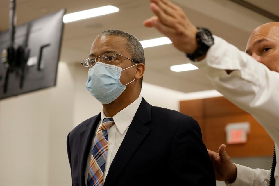 Medical Examiner Dr. Terrill Tops enters the courtroom to testify during the penalty phase of the trial of Marjory Stoneman Douglas High School shooter Nikolas Cruz at the Broward County Courthouse in Fort Lauderdale on Monday, August 1, 2022. Cruz previously plead guilty to all 17 counts of premeditated murder and 17 counts of attempted murder in the 2018 shootings.