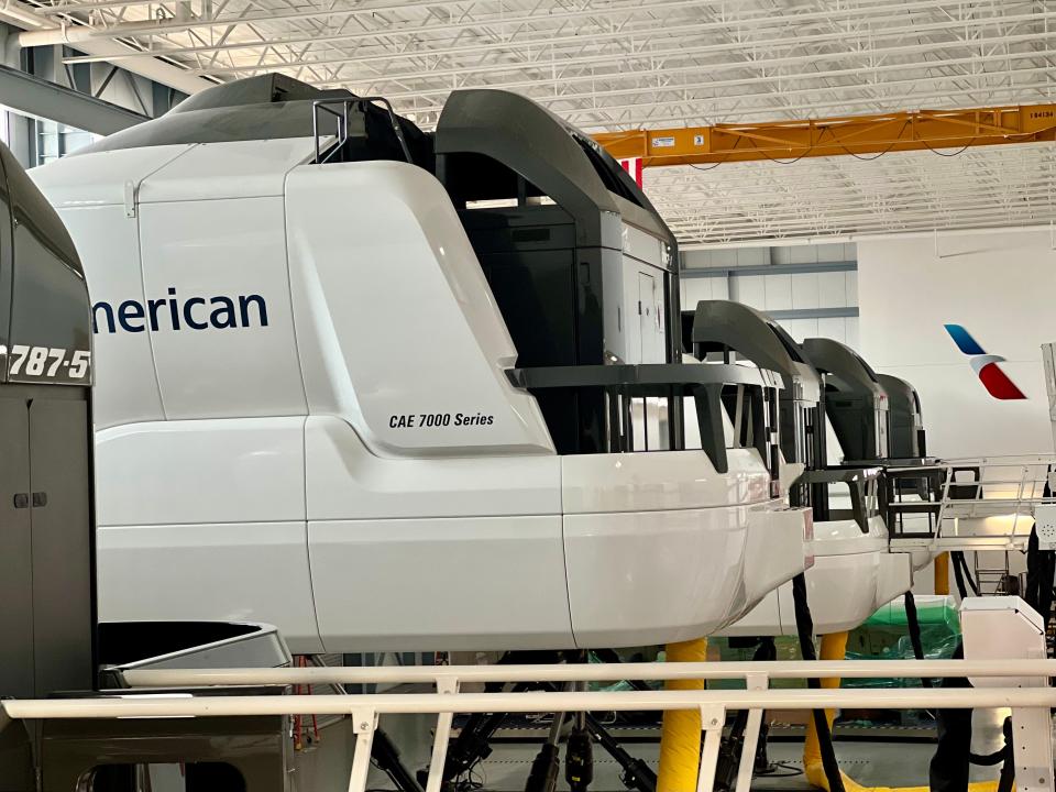 Line of white CAE sim at AA headquarters.