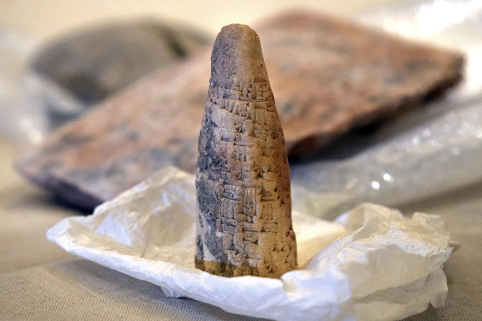 Iraqi antiquities are displayed during a ceremony held at the National Museum of Beirut before 337 artifacts were handed over by Lebanese Minister of Culture Mohammed Murtada to Iraq's ambassador to Lebanon, in Beirut, Lebanon, Sunday, Feb. 6, 2022. Until they were handed over, the artifacts had been kept at the private Nabu Museum in north Lebanon. (AP Photo/Bilal Hussein)