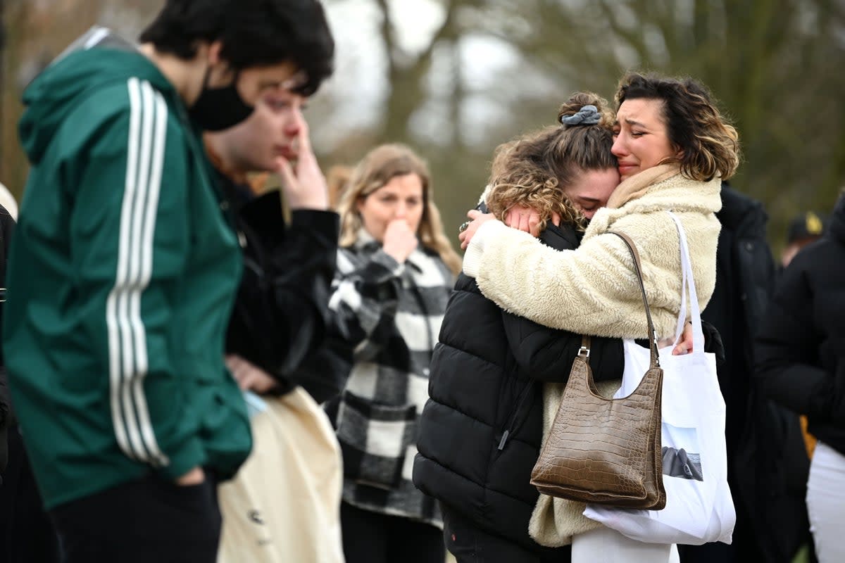 Tributes paid to Sarah Everard at Clapham Common vigil: Two women embrace as they stand before tributes for Sarah Everard (Getty Images)