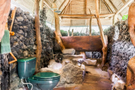 <p>The natural bathroom is also one of the highlights of the property. It boasts 20 foot stone walls, which are made from black lava rock, while the floors are made of flag stone. <br> (Airbnb) </p>