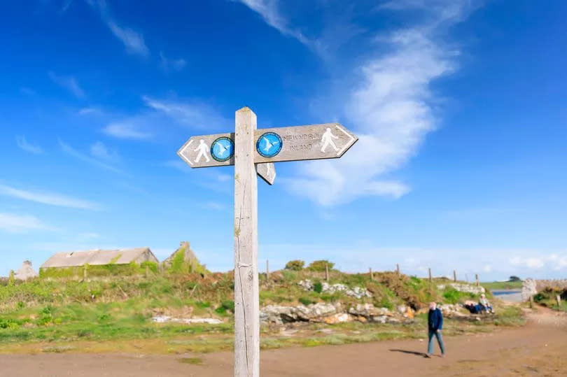 Coastal Path waymarker at Cemlyn Bay