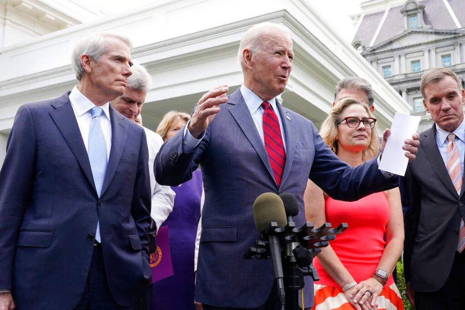 President Joe Biden, with a bipartisan group of senators, speaks on June 24, 2021, outside the White House in Washington. Biden invited members of the group of 21 Republican and Democratic senators to discuss the infrastructure plan. From left are Sen. Rob Portman, R-Ohio, Sen. Bill Cassidy, R-La., Sen. Lisa Murkowski, R-Alaska, Biden, Sen, Joe Manchin, D-W.Va., rear, Sen. Kyrsten Sinema, D-Ariz, and Sen. Mark Warner, D-Va.