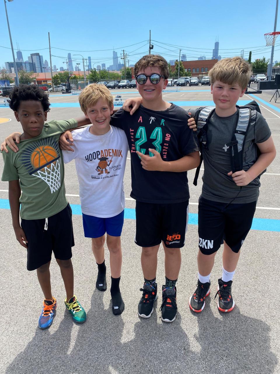 Hoopademix participants Jermaine Thomas, Oliver Plax, Hunter Ochstein and Holden Thomas learn about basketball basics and build lifelong friendships.