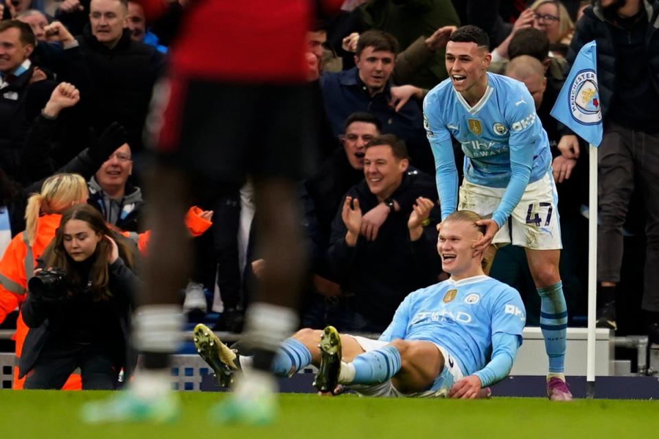 Erling Haaland and Phil Foden missed Manchester City training on Tuesday (AP)