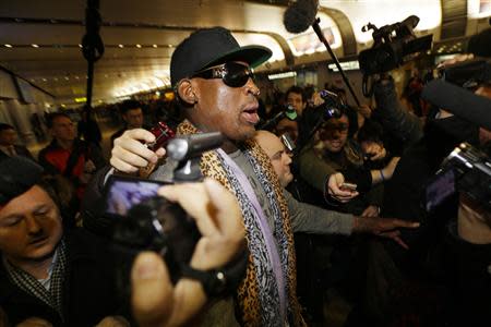 Former NBA basketball player Dennis Rodman speaks to the media as he returns from his trip to North Korea at Beijing airport, December 23, 2013. REUTERS/Jason Lee