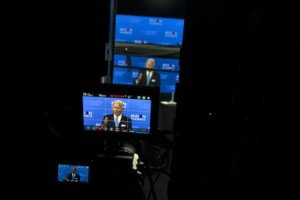 FILE - In this Aug. 12, 2020, file photo Democratic presidential candidate former Vice President Joe Biden is seen on monitors as he speaks during a virtual grassroots fundraiser at the Hotel DuPont in Wilmington, Del. As Democrats gather virtually this week to nominate Joe Biden for the presidency, party leaders and activists across the political spectrum agree on one unifying force: their desire to defeat President Donald Trump. (AP Photo/Carolyn Kaster, File)