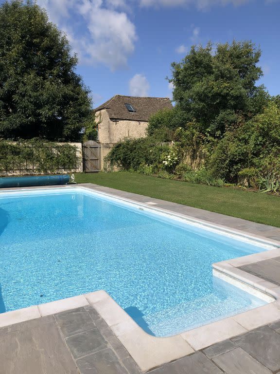 <p>One for the summer months, this cottage with a pool in the Cotswolds is great for having a watery spot to cool down in as you get to know this country hotspot's pretty towns and villages. This cottage is set near Tetbury and ideal for an active escape (think <a href="https://www.womenshealthmag.com/uk/fitness/a33333604/intermittent-fasting-walking-weight-loss-success-story/" rel="nofollow noopener" target="_blank" data-ylk="slk:long walks;elm:context_link;itc:0;sec:content-canvas" class="link ">long walks</a>) as you'll love retiring to the country cottage after long days outside – and popping into the local pubs as you get to know the surroundings.</p><p><strong>Sleeps:</strong> 10</p><p><strong>Pets: </strong>Yes</p><p><strong>Bring:</strong> Your <a href="https://www.womenshealthmag.com/uk/fitness/yoga/g25471397/best-yoga-mats/" rel="nofollow noopener" target="_blank" data-ylk="slk:exercise mat;elm:context_link;itc:0;sec:content-canvas" class="link ">exercise mat</a> for sun-kissed workouts by the pool.</p><p><strong>Price: </strong>£350 per night</p><p><strong>Available from: </strong><a href="https://go.redirectingat.com?id=127X1599956&url=https%3A%2F%2Fwww.homeaway.co.uk%2Fp89446&sref=https%3A%2F%2Fwww.womenshealthmag.com%2Fuk%2Ffitness%2Ffitness-holidays%2Fg33559308%2Fcottages-with-pools%2F" rel="nofollow noopener" target="_blank" data-ylk="slk:HomeAway;elm:context_link;itc:0;sec:content-canvas" class="link ">HomeAway</a></p>