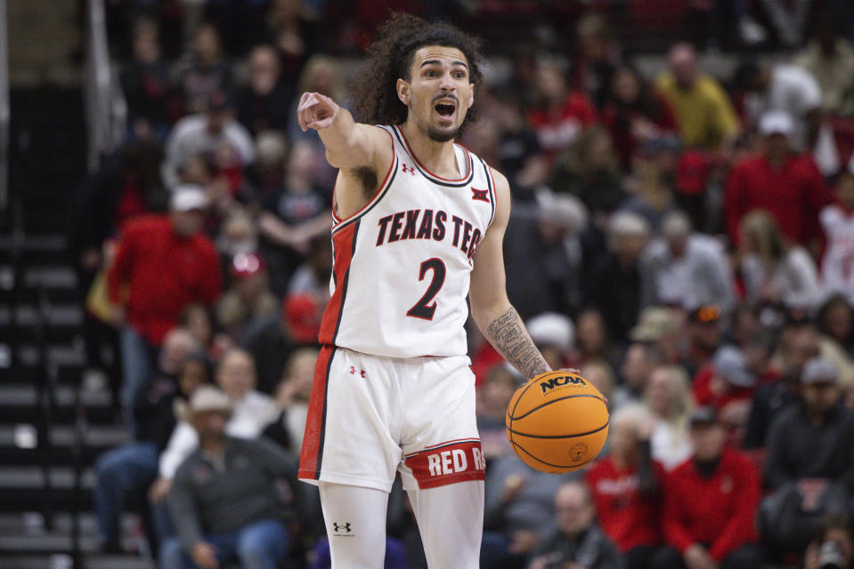 Texas Tech Pop Isaacs (2) calls a play during the first half of an NCAA college basketball game against TCU, Saturday, Feb. 25, 2023, in Lubbock, Texas. (AP Photo/Chase Seabolt)