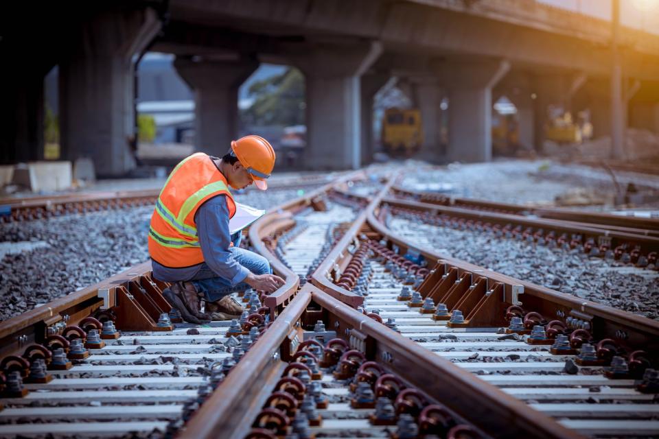 Railroad worker on tracks. 