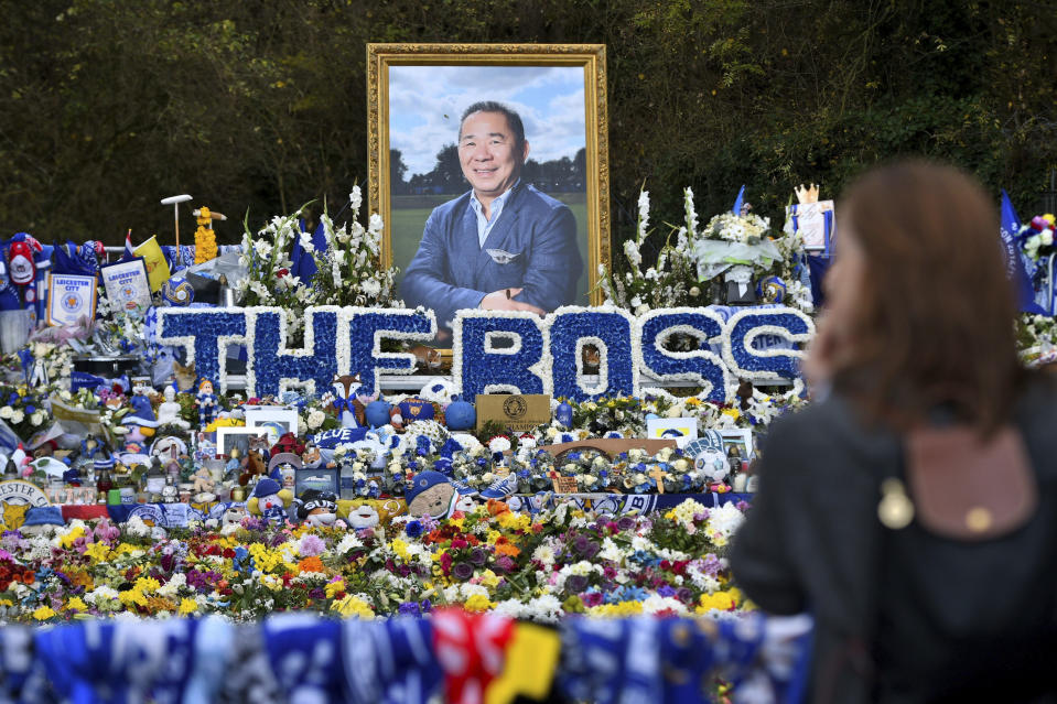 Floral tributes for those who lost their lives in the Leicester City helicopter crash including Leicester City Chairman Vichai Srivaddhanaprabha ahead of the Premier League match against Burnley at the King Power Stadium, Leicester, England, Saturday Nov. 10, 2018. (Joe Giddens/PA via AP)