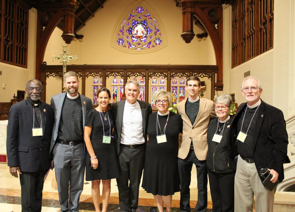 The Rev. Charlie Holt, Episcopal Diocese of Florida's newly named bishop coadjutor elect, and wife Brooke, (second and third from left), pose with North Florida-area clergy: (from left) the Rev. Hugh Chapman, St. Michael's & All Angels, Tallahassee; the Rev. Justin Yawn, St. Francis In-The-Field Episcopal Church, Ponte Vedra Beach; the Rev. Sarah Minton, All Saints Episcopal Church, Jacksonville; the Rev. Joseph G. Hodsdon, San Jose Episcopal Church, Jacksonville; the Rev. Deacon Lydia Bush, St. Luke's Episcopal Church, Jacksonville; and the Rev. Dr. Mark Gabel, St Mary's Episcopal Church, Green Cove Springs.