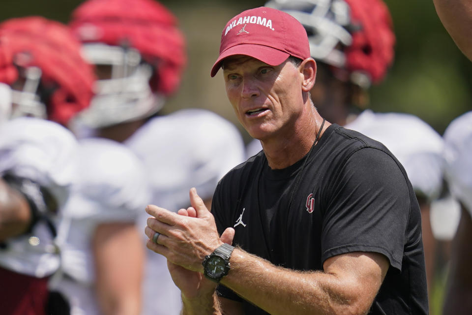 FILE - Oklahoma coach Brent Venables applauds during the NCAA college football team's practice Wednesday, Aug. 10, 2022, in Norman, Okla. (AP Photo/Sue Ogrocki)