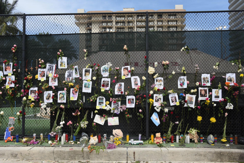 Posters of missing loved ones hang on a fence on a nearby tennis court in Surfside on June 26.<span class="copyright">Michele Eve Sandberg—Shutterstock</span>