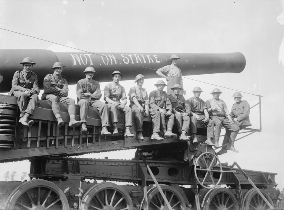 In this Aug. 23, 1917 photo released by the Imperial War Museum, soldiers of the Royal Marine Artillery sit on a railway gun during the Battle of Langemarck in Woesten, Belgium. Britain's Imperial War Museum is launching an ambitious online database on Monday, May 12, 2014 to remember the lives of the millions of men and women who served in World War One. The museum hopes that the history project, timed to coincide with the 100th anniversary of WWI, could form a permanent digital memorial to the scores of soldiers, nurses and others from Britain and the Commonwealth who contributed to the war by piecing together their life stories. (AP Photo/IWM Q2764)