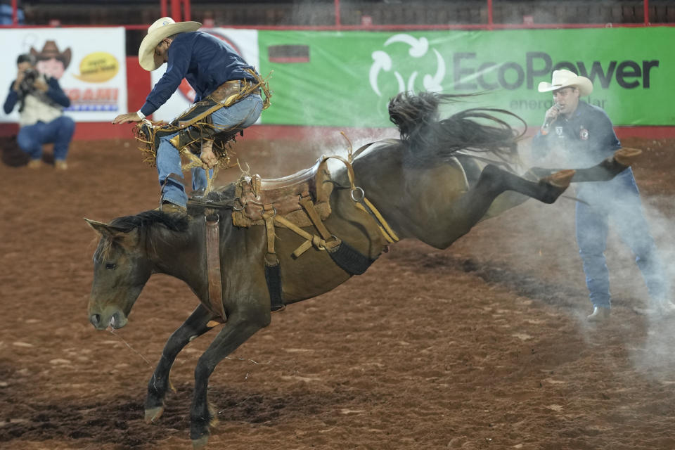 A cowboy is ejected from a horse during horse riding competition at the Barretos Rodeo International Festival in Barretos, Sao Paulo state Brazil, Friday, Aug. 26, 2022. (AP Photo/Andre Penner)