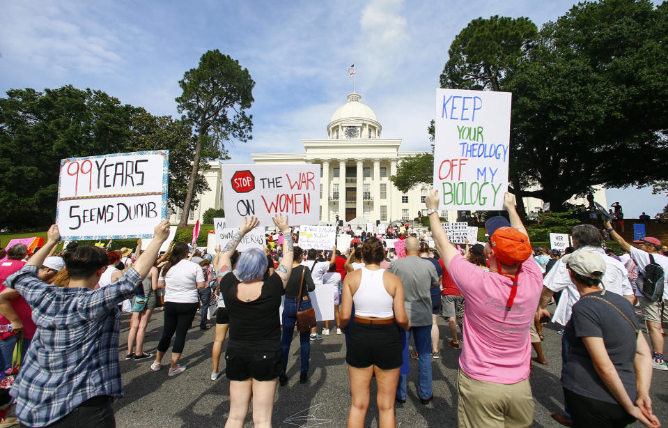 FILE - Protesters for women's rights hold a rally on the Alabama Capitol steps to protest a law passed the week before making abortion a felony in nearly all cases with no exceptions for cases of rape or incest, Sunday, May 19, 2019, in Montgomery, Ala. Health care providers and an abortion assistance fund in Alabama filed a lawsuit against state Attorney General Steve Marshall, Monday, July 31, 2023, over threats to prosecute people who help women arrange abortions outside the state. (AP Photo/Butch Dill, File)