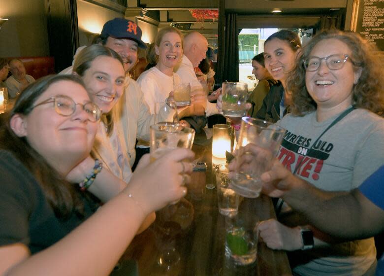 LOS ANGELES, CA - SEPTEMBER 24: Members of the WGA met for drinks at Neat, to celebrate after striking a deal with the studios a Sorry Not Sorry Bar on Sunday, Sept. 24, 2023 in Los Angeles, CA. Sunday marked the fifth straight day of talks, which kicked off Wednesday with the heads of four major studios participating directly.(John McCoy / For The Times)