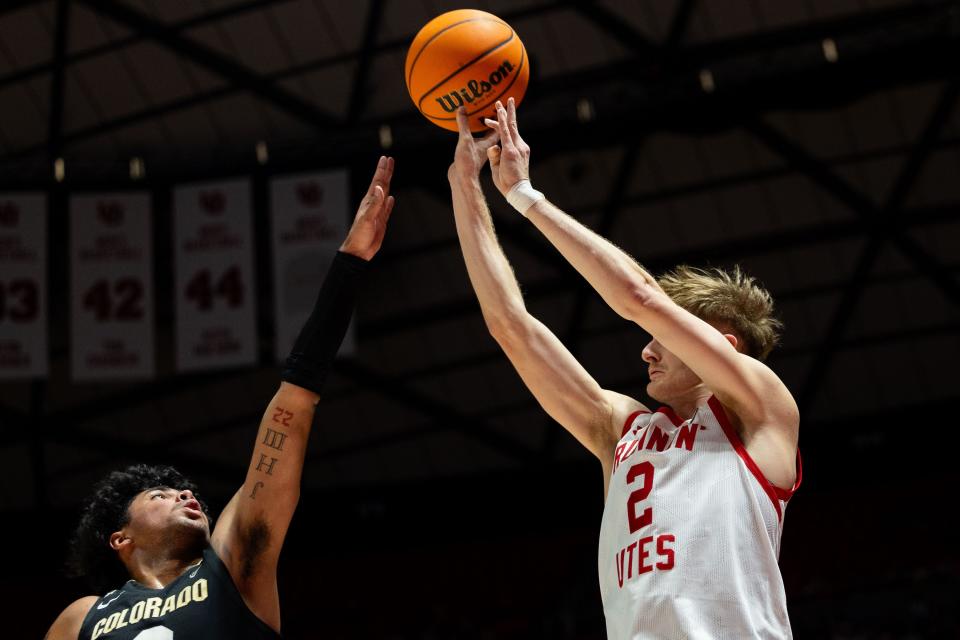 Utah Utes guard Cole Bajema (2) shoots the ball with Colorado Buffaloes guard Julian Hammond III (3) on defense during the men’s college basketball game between the Utah Utes and the Colorado Buffaloes at the Jon M. Huntsman Center in Salt Lake City on Saturday, Feb. 3, 2024. The teams are tied 31-31 at half-time. | Megan Nielsen, Deseret News