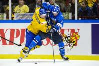Sweden's Jesper Pettersson (L) vies with Finland's Artturi Lehkonen during their IIHF World Junior Championship Group B preliminary round ice hockey match at Malmo Arena in Malmo, December 28, 2013. REUTERS/Ludvig Thunman/TT News Agency (SWEDEN - Tags: SPORT ICE HOCKEY) ATTENTION EDITORS - THIS IMAGE HAS BEEN SUPPLIED BY A THIRD PARTY. IT IS DISTRIBUTED, EXACTLY AS RECEIVED BY REUTERS, AS A SERVICE TO CLIENTS. SWEDEN OUT. NO COMMERCIAL OR EDITORIAL SALES IN SWEDEN. NO COMMERCIAL SALES