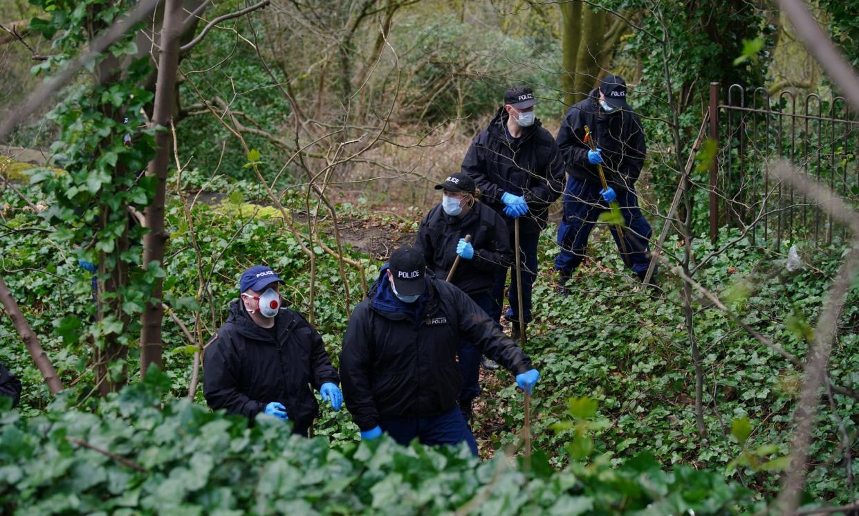 <span>Police officers carry out searches at Kersal Dale, near Salford on 5 April.</span><span>Photograph: Peter Byrne/PA</span>