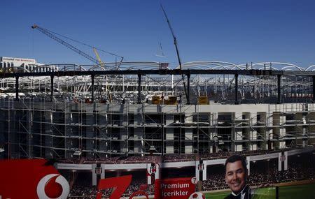 Employees work on the construction of Vodafone Arena, which will be the new home ground of Turkish Soccer team Besiktas replacing the old Inonu Stadium, in Istanbul, Turkey February 2, 2016. REUTERS/Murad Sezer