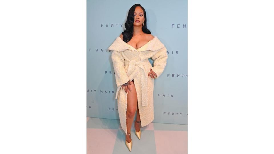 Rihanna attends the launch of Fenty Hair exclusively at Selfridges on September 16, 2024 in London, England wearing a fluffy coat as a dress