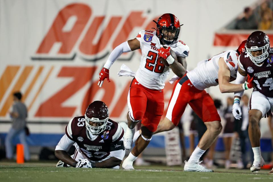 Texas Tech running back Tahj Brooks (28) makes tracks during the Red Raiders' 34-7 victory over Mississippi State two years ago at the Liberty Bowl in Memphis, Tennessee. The Red Raiders depart Wednesday for the Independence Bowl in Shreveport, Louisiana. Tech faces California at 8:15 p.m. Saturday.