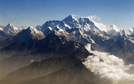 Mount Everest (C), the world's highest peak, and other peaks of the Himalayan range are seen from air during a mountain flight from Kathmandu, in this file picture taken April 24, 2010. REUTERS/Tim Chong/Files