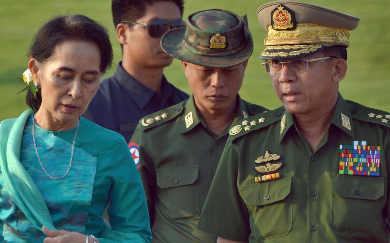 Aung San Suu Kyi and General Min Aung Hlaing were reported to have a tense relationship - Aung Shine Oo/AP