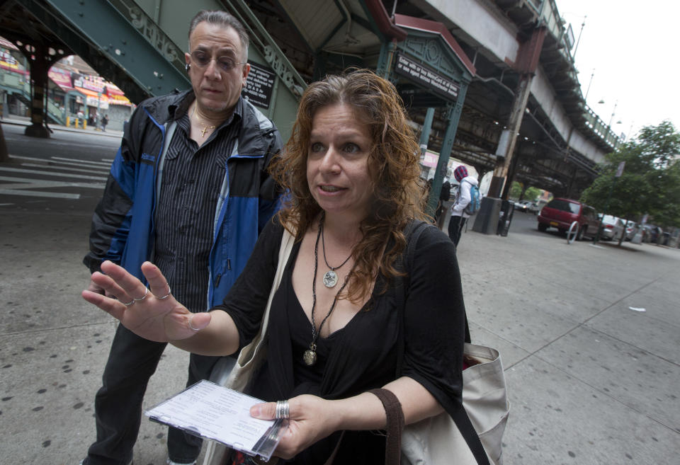 Folklorist Elena Martinez of City Lore, and her partner Bobby Sanabria, talk about their tours of The Bronx borough of New York, Wednesday, May 22, 2013. A company that offered tourist treks to the Bronx "ghetto" has shut down under scathing criticism from neighborhood leaders offended by the tours that took mostly European and Australian tourists past food-pantry lines and "pickpocket" park. But other New York companies continue to show visitors, many of them foreigners who know of the Bronx only from movies, the grittiest part of the city's poorest borough. (AP Photo/Richard Drew)