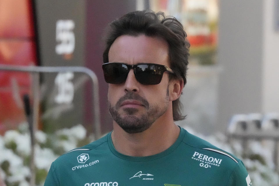 Aston Martin driver Fernando Alonso of Spain is on his way to a press conference at the Bahrain International Circuit in Sakhir, Bahrain, Thursday, March 2, 2023. The Bahrain GP will be held on Sunday March 5, 2023.(AP Photo/Frank Augstein)