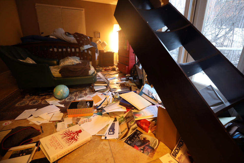 The contents of a bookshelf lie on the floor after an earthquake in Anchorage, Alaska, Nov. 30, 2018. (Photo: Nathaniel Wilder/Reuters)