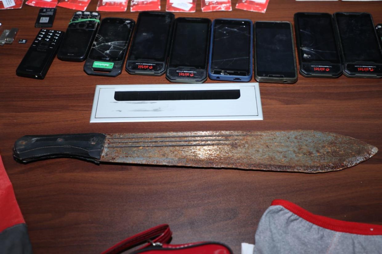 A photo shared by Kenya's National Police force and its Directorate of Criminal Investigations on July 15, 2024 shows items seized by officers from a 33-year-old man identified as Collins Jumaisi Khalusha, whom they called the prime suspect in the murder of 42 women in Nairobi. / Credit: Kenyan National Police/Directorate of Criminal Investigations