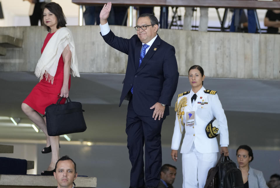 Prime Minister of Peru Alberto Otarola waves upon arrival for the South American Summit at Itamaraty palace in Brasilia, Brazil, Tuesday, May 30, 2023. South America’s leaders are gathering as part of President Luiz Inácio Lula da Silva’s attempt to reinvigorate regional integration efforts.(AP Photo/Andre Penner)