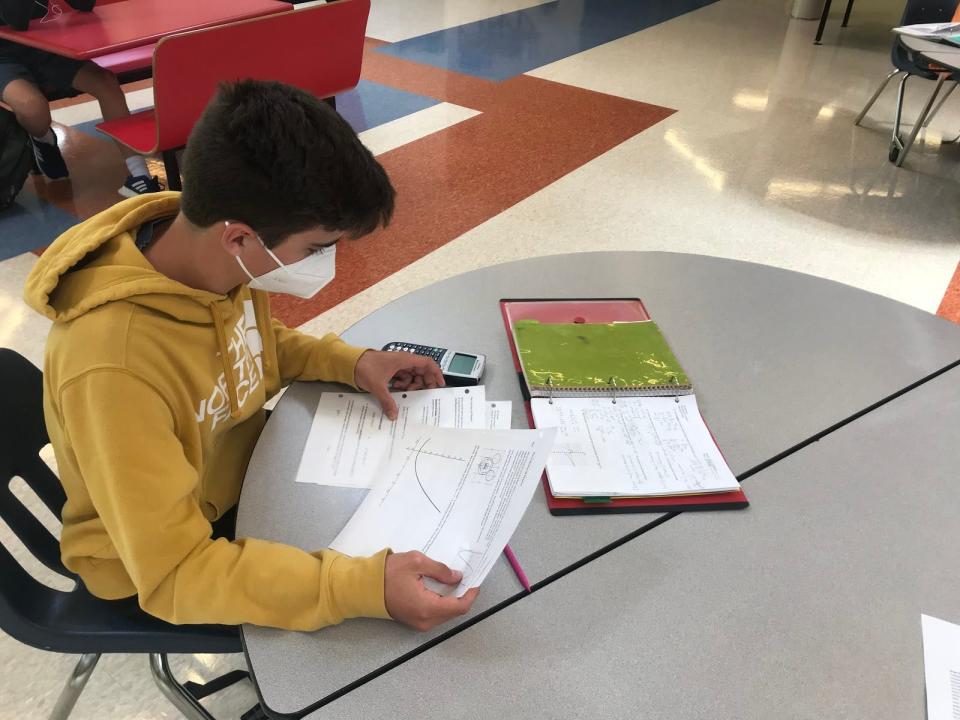 A Champlain Valley Union High School student performs calculations for school work while masked and distant from the nearest student in accordance with COVID-19 regulations. Picture provided Jan. 2021.