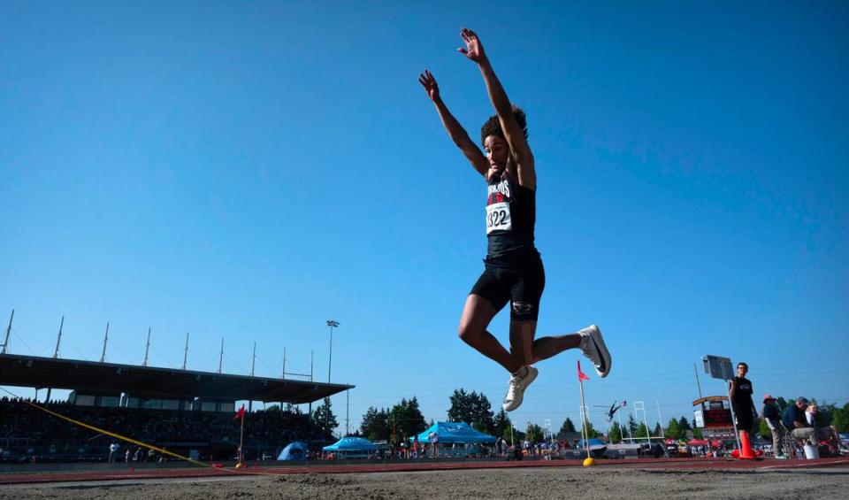 Yelm’s Trevontay Smith leaps into the pit en route to a state title in the 3A boys triple jump competition with a new meet record of 50’ 4 1/2” during the opening day of the WIAA state track and field championships at Mount Tahoma High School in Tacoma, Washington, on Thursday, May 25, 2023.