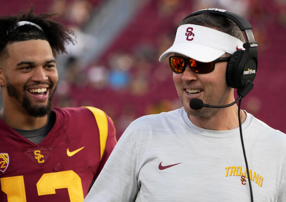 Los Angeles, CA - September 03:  Head coach Lincoln Riley of the USC Trojans all smiles with quarterback Caleb Williams #13 of the USC Trojans in the second half of a NCAA football game at the Los Angeles Memorial Coliseum in Los Angeles on Saturday, September 3, 2022. USC Trojans defeated the Rice Owls 66-14. (Photo by Keith Birmingham/MediaNews Group/Pasadena Star-News via Getty Images)