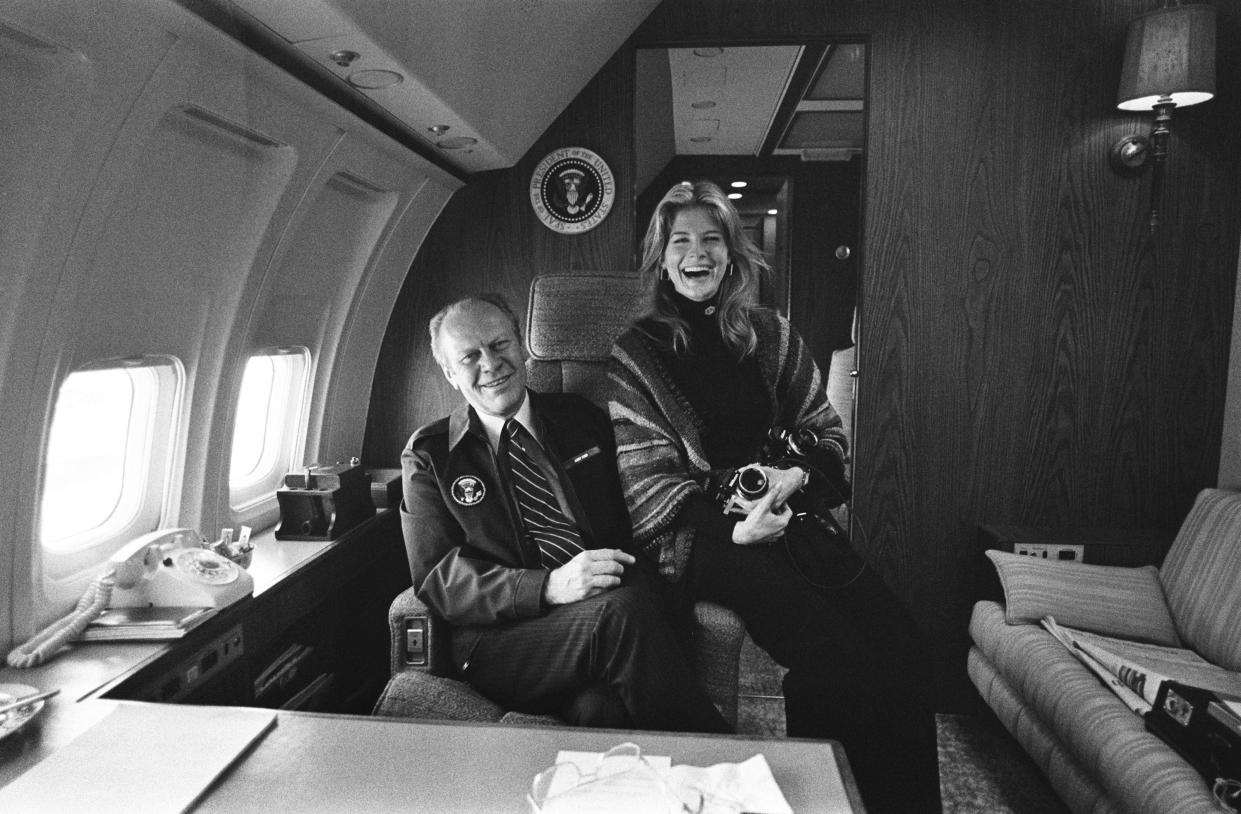Gerald Ford with a photographer on Air Force One.