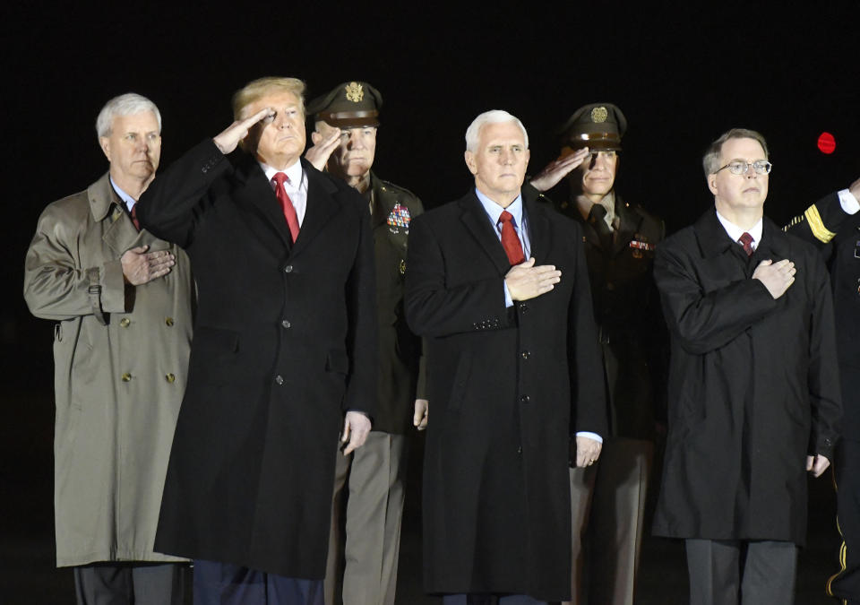 From left, General Counsel of the Army James McPherson, President Donald Trump, Army Chief of Staff Gen. James C. McConville, Vice President Mike Pence, Sgt. Maj. Michael Grinston and Deputy Secretary of Defense David Norquist stand during the casualty return of Sgt. 1st Class Javier J. Gutierrez and Sgt. 1st Class Antonio Rey Rodriguez, Monday, Feb. 10, 2020, at Dover Air Force Base, Del. According to the Department of Defense, Gutierrez, 28, of San Antonio, and Rodriguez, 28, of Las Cruces, N.M., died in Nangarhar province, Afghanistan, of wounds sustained during combat operations. (AP Photo/Steve Ruark)