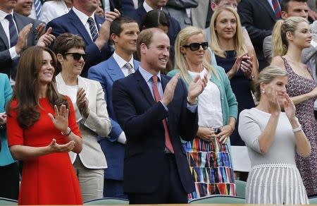 Britain's Catherine Duchess of Cambridge and Prince William (C) applaud after Andy Murray of Britain won his match against Vasek Pospisil of Canada at the Wimbledon Tennis Championships in London, July 8, 2015. REUTERS/Suzanne Plunkett