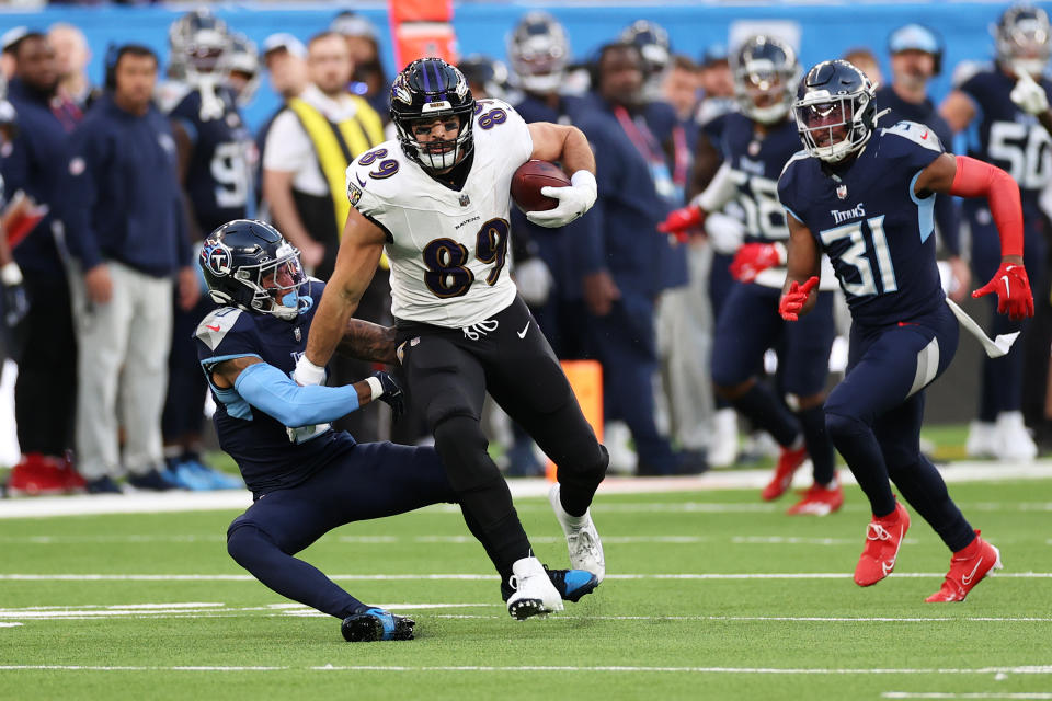 LONDON, ENGLAND – OCTOBER 15: Mark Andrews #89 of the Baltimore Ravens is tackled by Sean Murphy-Bunting #0 of the Tennessee Titans in the fourth quarter during the 2023 NFL London Games match between Baltimore Ravens and Tennessee Titans at Tottenham Hotspur Stadium on October 15, 2023 in London, England. (Photo by Ryan Pierse/Getty Images)