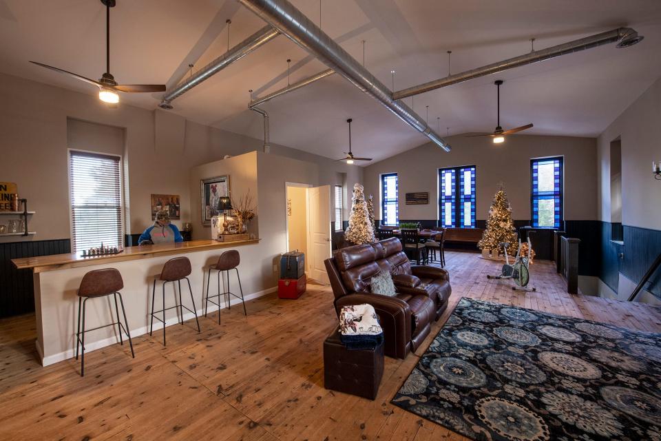 The upstairs living space is equipped with a bar.