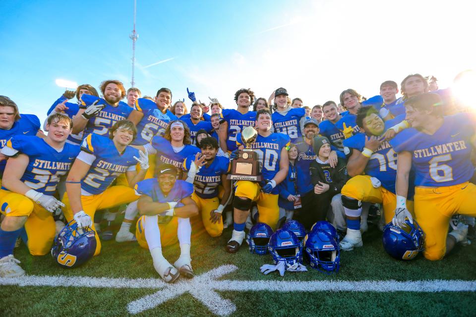 Stillwater players hold up the trophy after defeating Choctaw 26-21 at the 6A-II State Championship football game between Stillwater High School and Choctaw High School played at Chad Richison Stadium at the University of Central Oklahoma in Edmond on Friday, Dec. 2, 2022.