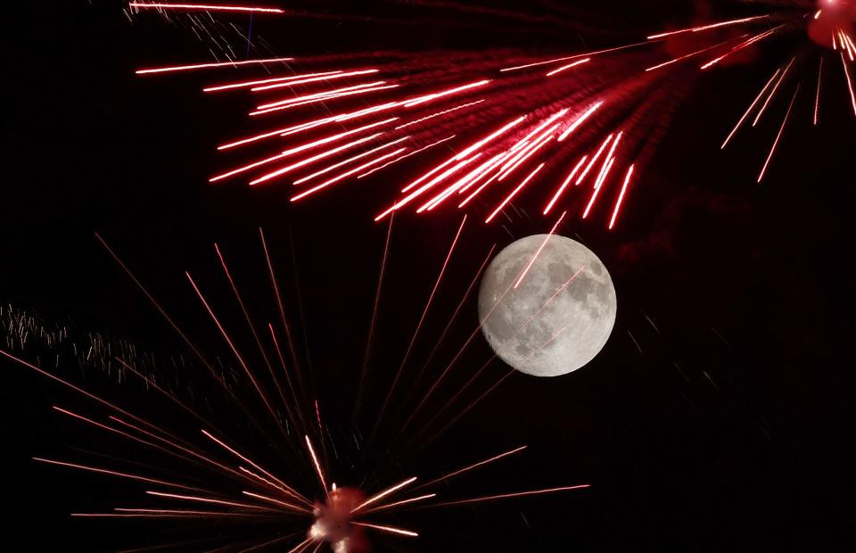 Fireworks explode in front of the moon over LaVell Edwards Stadium at the Stadium of Fire in Provo on Saturday, July 1, 2023. | Scott G Winterton, Deseret News