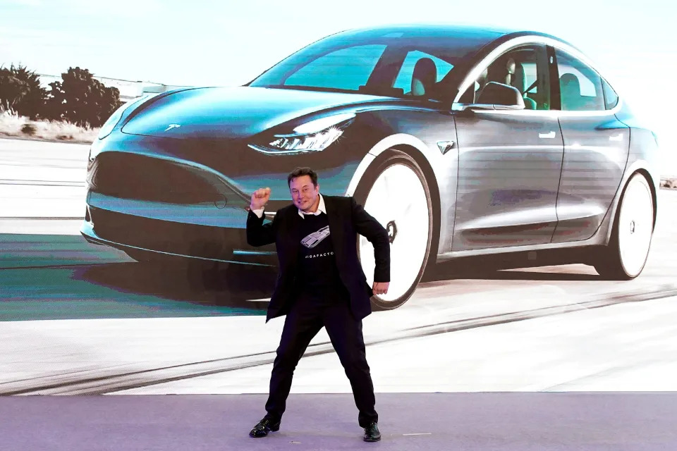 Tesla Inc CEO Elon Musk dances onstage during a delivery event for Tesla China-made Model 3 cars in Shanghai